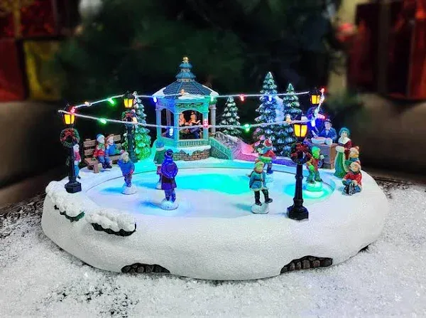 Moments in Time 7.28”H Animated Skating Pond (Moving SKATERS) - LED Lights, 8 Classic Carols Christmas Music, Adapter Included or Battery Operated